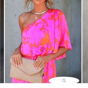 The dress is the blue .. the pics are of the same dresss in diff color